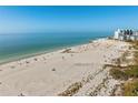 Expansive beach view near the condo complex, with white sand and blue waters at 6500 Sunset Way # 311, St Pete Beach, FL 33706