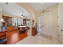 Inviting home foyer showcasing an open floor plan with wood floors and adjacent living space at 6540 Tailfeather Way, Bradenton, FL 34203