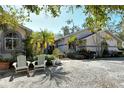 Beautiful home featuring gravel driveway and meticulously landscaped yard at 746 Plymouth St, Sarasota, FL 34242