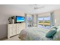 Tranquil main bedroom featuring bright windows with a scenic water view and a light, airy design at 866 Audubon Dr, Bradenton, FL 34209