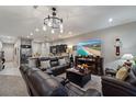 Comfortable living room featuring recessed lights, a fireplace and three reclining leather sofas at 1038 Grantham Dr, Sarasota, FL 34234