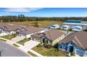 An aerial view of the home showcasing its well-manicured lawn in a peaceful residential neighborhood at 1901 Everson St, Bradenton, FL 34208