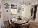 Inviting dining area featuring a round table and decorative accents at 3528 Lake Bayshore Dr # K-115, Bradenton, FL 34205