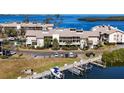 Waterfront complex featuring private boat docks for residents, and ample parking at 3850 Mariners Walk # 713, Cortez, FL 34215
