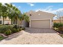 Inviting single-Gathering home featuring a brick-paved driveway and manicured landscaping at 4114 63Rd E Ter, Sarasota, FL 34243