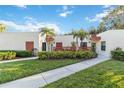 Charming condo with well-maintained landscaping, walkway, and decorative privacy fence at 805 Spring Lakes Blvd # 805, Bradenton, FL 34210