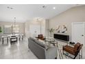 Bright living room with white floors, neutral walls, and modern furniture at 124 Mark Twain Ln, Rotonda West, FL 33947