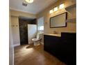 Well-lit bathroom with a tiled shower, modern vanity, and neutral tones, creating a relaxing atmosphere at 2001 Logsdon St, North Port, FL 34287