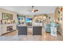 Bright and airy living room featuring tiled floors, coastal decor and comfortable furnishings at 2080 Padre Island Dr # 211, Punta Gorda, FL 33950