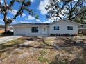 Charming one-story home with a well-maintained lawn and inviting entrance at 3325 Woodmont Dr, Sarasota, FL 34232