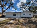 Charming one-story home with a well-maintained lawn and inviting entrance at 3325 Woodmont Dr, Sarasota, FL 34232