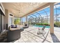 Screened patio featuring comfortable outdoor seating and a view of the inviting pool at 4744 Benito Ct, Bradenton, FL 34211