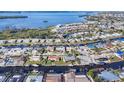 Aerial view of a waterfront community with canals and the subject property encircled for easy location at 5012 Bimini Dr, Bradenton, FL 34210