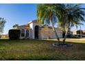 Charming single-Gathering home featuring a well-manicured lawn and mature landscaping at 5638 Oakshire Ave, Sarasota, FL 34233