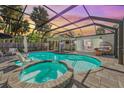 Amazing outdoor space with pool, spa, and covered patio, ideal for entertaining and relaxation at 615 Avenida Del Norte, Sarasota, FL 34242