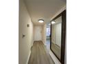 Inviting entryway with a neutral color palette, wood-look flooring, and large mirror at 6330 7Th W Ave, Bradenton, FL 34209