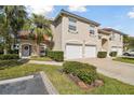 Two-story townhouse with dual garage, red tile roof, and well-maintained landscaping at 7232 Cedar Hollow Cir # 7232, Bradenton, FL 34203