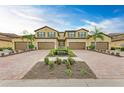 Symmetrical front view of a villa with a well-manicured garden at 12510 Ghiberti Cir # 102, Venice, FL 34293