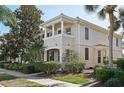 Stunning multi-story home featuring classic architecture, manicured landscaping, and a welcoming entrance at 1555 Napoli W Dr, Sarasota, FL 34232