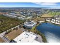 Aerial view of the condo complex showing proximity to a lake, golf course, and community amenities at 2001 Bal Harbor Blvd # 2301, Punta Gorda, FL 33950