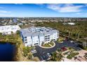 Aerial view of the condo complex showcasing the surrounding lush greenery and well-maintained parking area at 2001 Bal Harbor Blvd # 2301, Punta Gorda, FL 33950