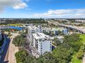 Beautiful aerial view of condo building with palm trees and manicured grounds, nestled near a highway at 201 W Laurel St # 209, Tampa, FL 33602