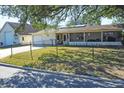 Charming single-story home with a detached garage and fenced front yard at 2202 21St W St, Bradenton, FL 34205