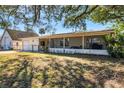 Charming single-story home with a detached garage and large screened in porch at 2202 21St W St, Bradenton, FL 34205