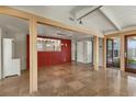 Bright living space with travertine flooring and direct sight lines into another room at 344 Monroe Dr, Sarasota, FL 34236