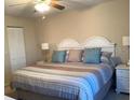 Comfortable bedroom featuring a queen bed with soft pillows and a neutral color scheme for relaxation at 3863 59Th W Ave # 4189, Bradenton, FL 34210