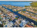 An aerial view showcases this neighborhood's waterfront access and boat-friendly canals at 4119 Royal Palm Dr, Bradenton, FL 34210