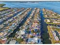 Aerial view of a waterfront neighborhood featuring access to boat canals and docks at 4119 Royal Palm Dr, Bradenton, FL 34210