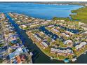 This aerial shows waterfront property and boating canals near the open water at 4119 Royal Palm Dr, Bradenton, FL 34210