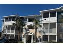 Attractive condo building featuring multiple stories, screened in balconies, and tasteful landscaping at 4802 51St W St # 1210, Bradenton, FL 34210