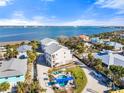 Aerial view of a charming coastal neighborhood with a pool and stunning water views, providing a serene living experience at 5031 N Beach Rd # 222, Englewood, FL 34223