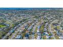 Overhead shot of neighborhood with homes, roads, greenery, and community layout at 6716 Keystone Dr, Sarasota, FL 34231