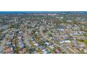 Wide aerial shot of a residential area featuring houses, roads, and scattered trees at 6716 Keystone Dr, Sarasota, FL 34231