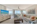 Light-filled living room with stylish furniture and ocean view at 775 Longboat Club Rd # 406, Longboat Key, FL 34228