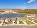 A neighborhood with a large pond, highlighting the ideal location for a relaxing lifestyle at 13528 Sunset Sapphire Ct, Parrish, FL 34219