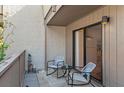 Private balcony with outdoor seating, ideal for relaxing and enjoying fresh air at 1680 Brookhouse Cir # 110, Sarasota, FL 34231
