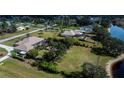 Residential neighborhood with mature trees and green spaces along a lake at 2002 Palm View Rd, Sarasota, FL 34240