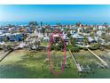 Beautiful waterfront home surrounded by lush landscaping with a private pier at 2306 Canasta Dr, Bradenton Beach, FL 34217