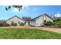 Beautiful single-story home featuring a manicured lawn and a two-car garage in a serene neighborhood at 3837 Torrey Pines Blvd, Sarasota, FL 34238