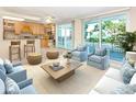 Inviting living room with lots of natural light and a view of the water at 4822 Ocean Blvd # 2D, Sarasota, FL 34242