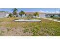 Well-maintained single-story home with a red tile roof, complemented by neatly kept landscaping and a green lawn at 4912 Beacon Rd, Palmetto, FL 34221