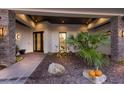 Inviting front entrance with elegant stone accents, manicured garden, and a modern doorway at 525 S Shore Dr, Osprey, FL 34229