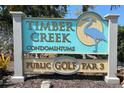 Timber Creek Condominiums sign with a heron, advertising a public Golf Par 3 course at 6071 Fairway Ln # 1424, Bradenton, FL 34210