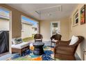 Covered patio featuring comfortable seating and a colorful rug, perfect for outdoor relaxation at 6140 Midnight Pass Rd # B6, Sarasota, FL 34242