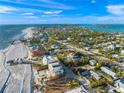 Beautiful aerial view of the coastline with beach houses, including one circled in white at 6537 Gulf Of Mexico Dr, Longboat Key, FL 34228