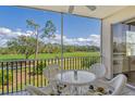 Enjoy the view from this screened lanai with outdoor seating overlooking the beautiful golf course at 8755 Olde Hickory Ave # 7204, Sarasota, FL 34238